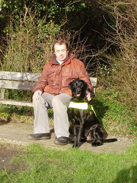 Man with his Black Labrador Mylo (opens in slideshow)